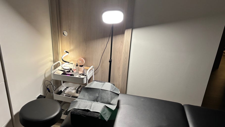 Treatment room at Lash 'N' Wink Essence, Surrey, BC, CA with a lighted workspace and equipment.