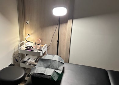 Treatment room at Lash 'N' Wink Essence, Surrey, BC, CA with a lighted workspace and equipment.