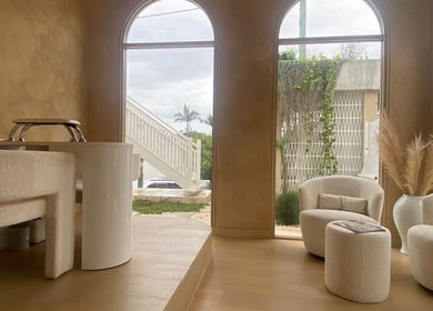 Elegant interior of Sugaplum Studio in Albion, Queensland, AU, featuring plush seating and soft lighting.