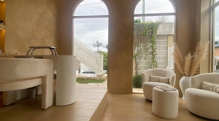 Elegant interior of Sugaplum Studio in Albion, Queensland, AU, featuring plush seating and soft lighting.