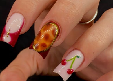 Stylish nail art with cherry design at Sugaplum Studio, Albion, Queensland, AU.