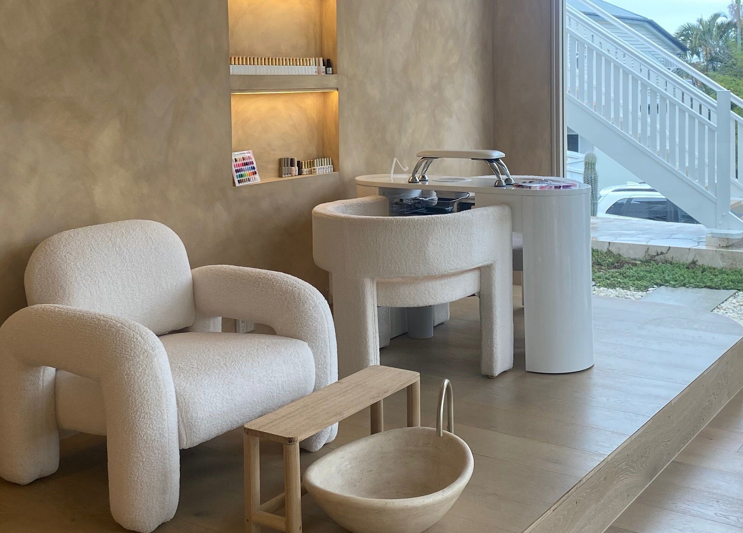 Chic beauty setup at Sugaplum Studio in Albion, Queensland, AU with plush seating and manicure station.