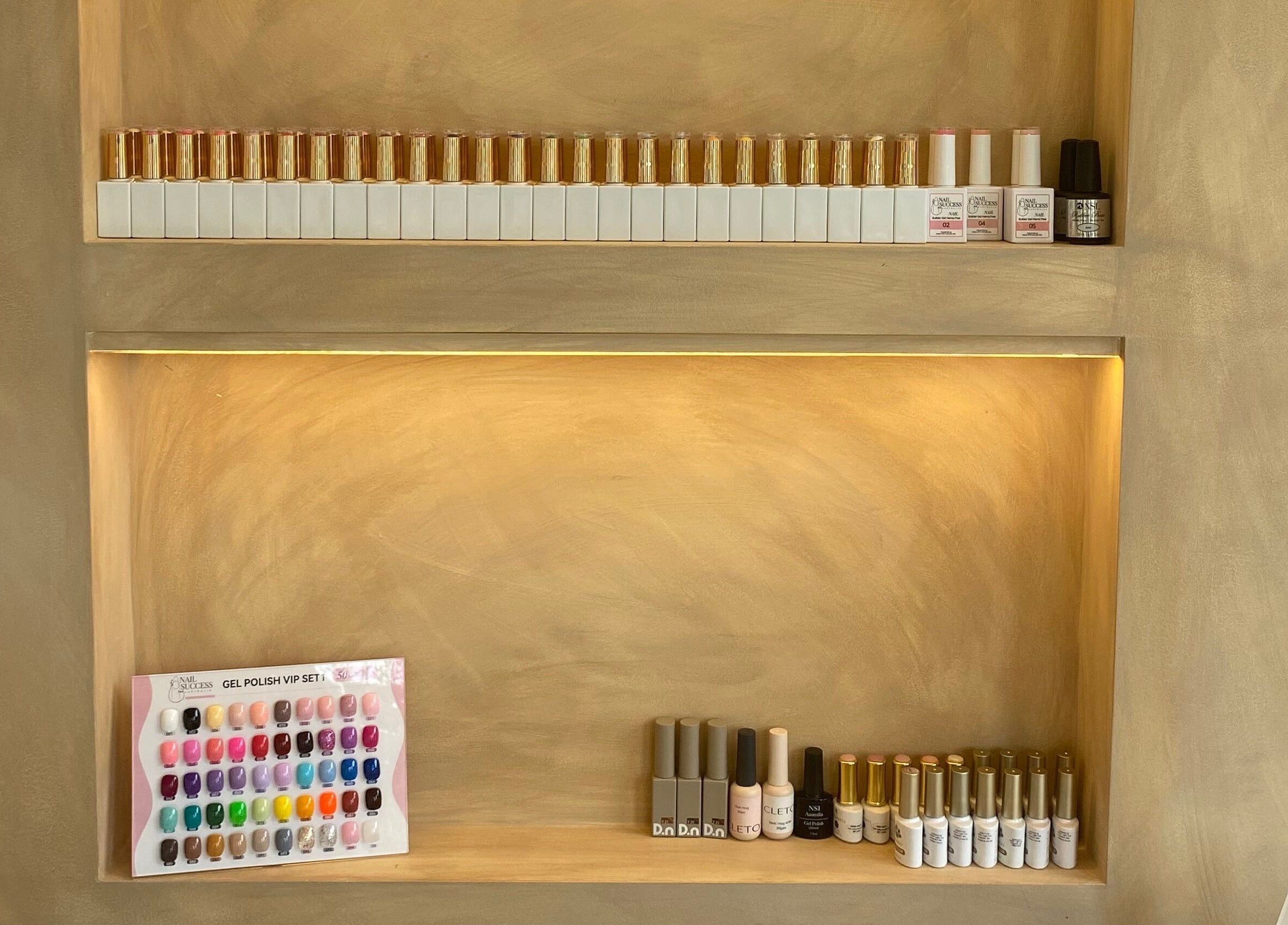 Neatly organized nail polishes at Sugaplum Studio, Albion, Queensland, AU, showcasing a wide color selection.