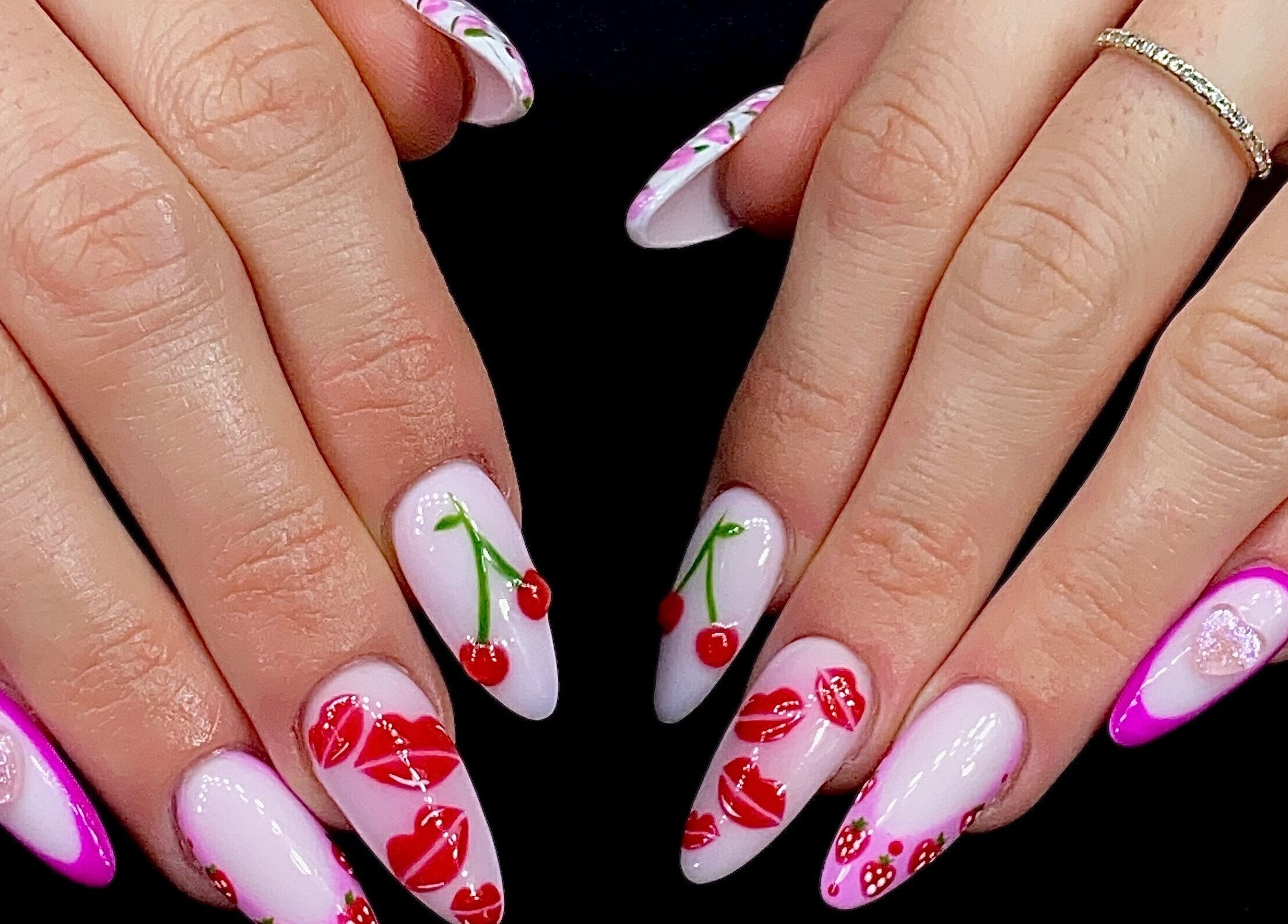Vibrant cherry-themed nail art at Sugaplum Studio in Albion, Queensland, AU, showcasing stylish designs.