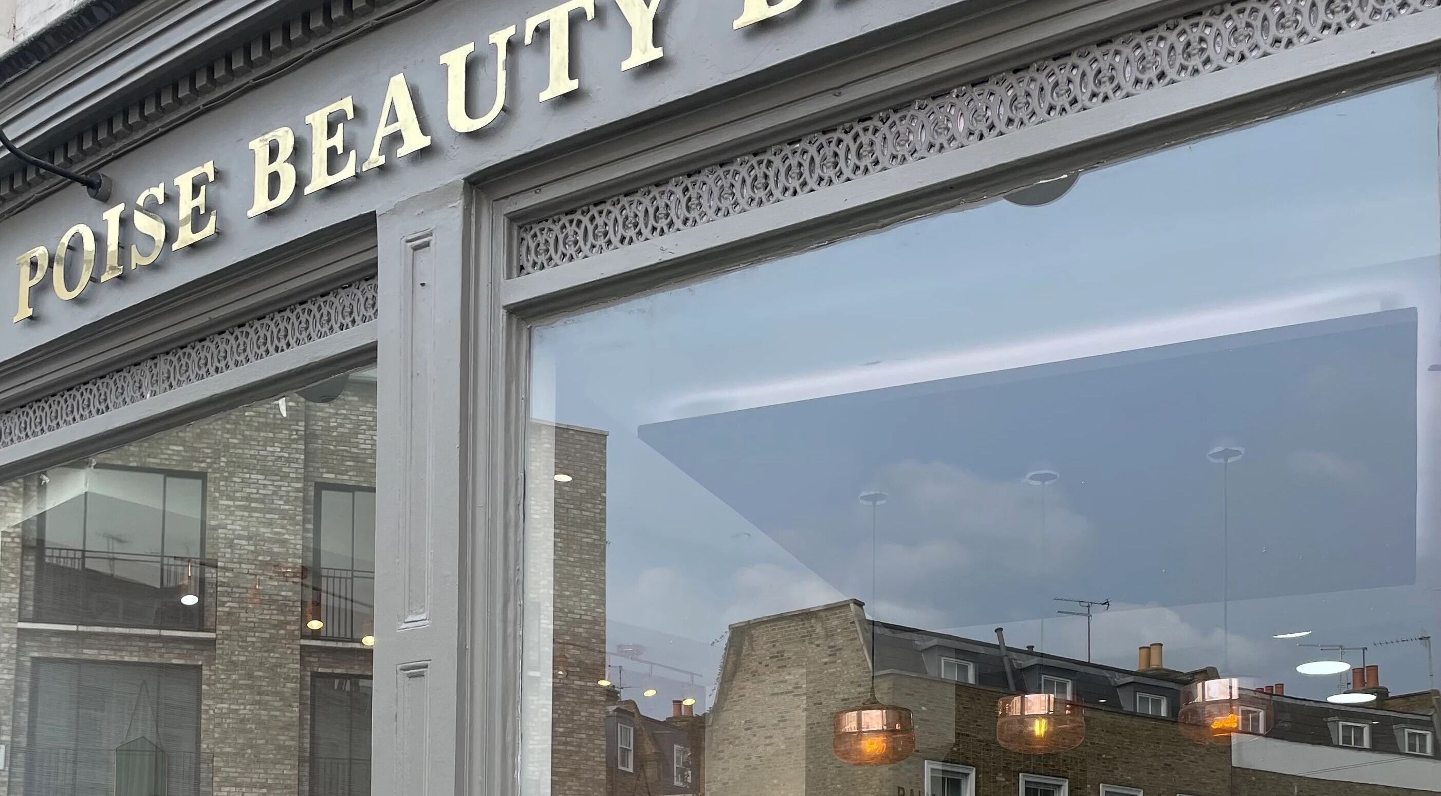 View of Hair By Radoushka storefront in London, England, GB with elegant signage.