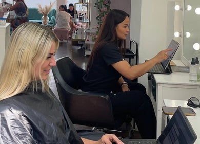 Guests enjoying styling at Hair By Radoushka in London, England, GB, showcasing modern beauty services.