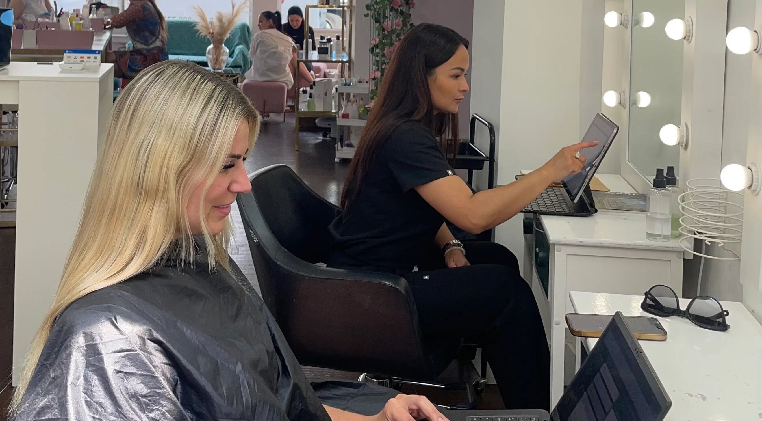 Guests enjoying styling at Hair By Radoushka in London, England, GB, showcasing modern beauty services.