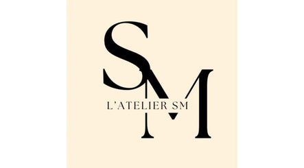 Logo élégant de L’atelier SM🤎 situé à Barentin, Normandie, FR.