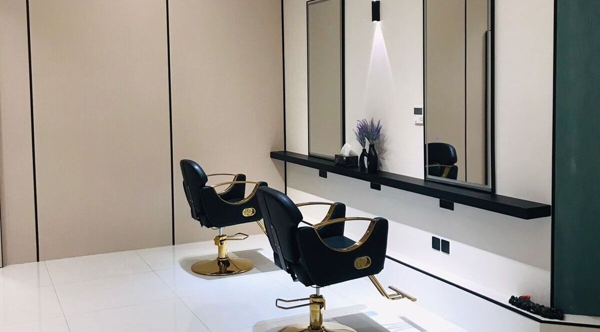 Modern salon stations at Beauty Look Ladies Care Center, Sharjah, AE, featuring elegant styling chairs and mirrors.