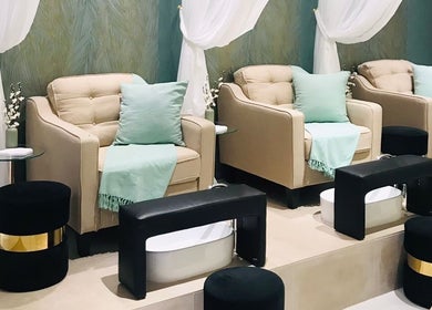 Elegant lounge chairs at Beauty Look Ladies Care Center, Sharjah, AE, with soothing decor and foot spas.