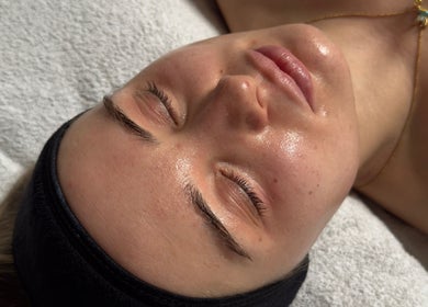 Relaxed client enjoying a facial treatment at Serene with Queen in Leicester, England, GB.