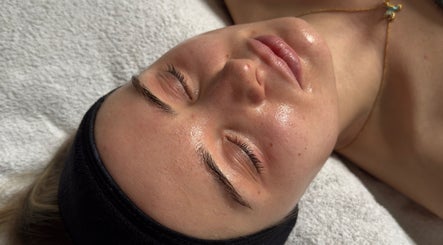 Relaxed client enjoying a facial treatment at Serene with Queen in Leicester, England, GB.