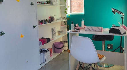 Nails by Jordan salon setup in Cape Town, Western Cape, ZA with vibrant walls and nail products on shelves.