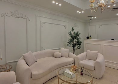 Chic lounge area at By Lana Lashes, Amman, Amman Governorate, JO with plush seating and ornate decor.