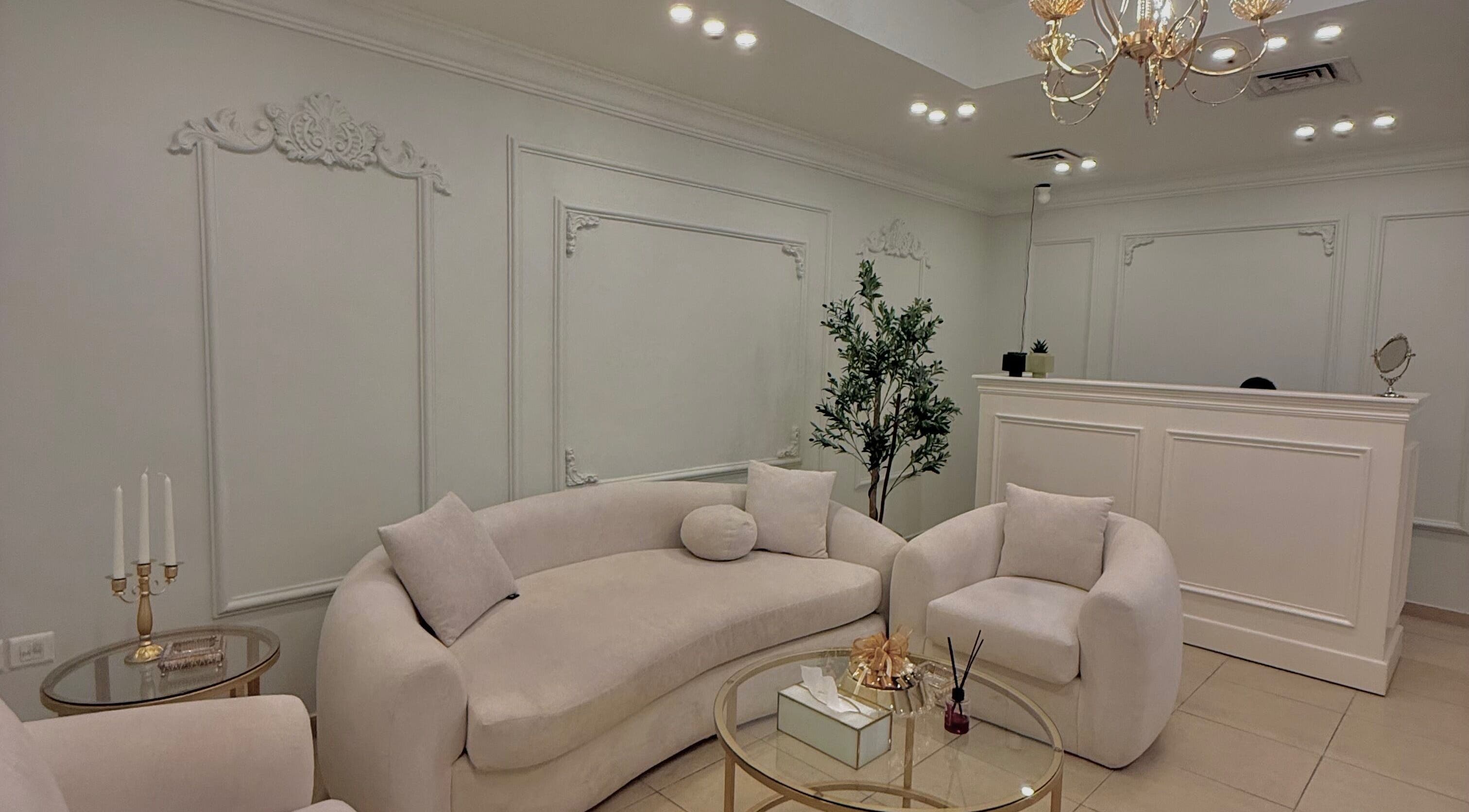 Chic lounge area at By Lana Lashes, Amman, Amman Governorate, JO with plush seating and ornate decor.