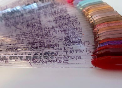 Colorful nail polish samples at Nail Love by Megan, North Port, Florida, US, showcasing vibrant shades.