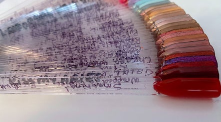 Colorful nail polish samples at Nail Love by Megan, North Port, Florida, US, showcasing vibrant shades.