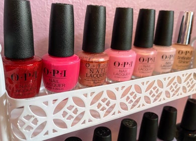 Colorful nail polishes on a shelf at Nail Love by Megan, North Port, Florida, US.