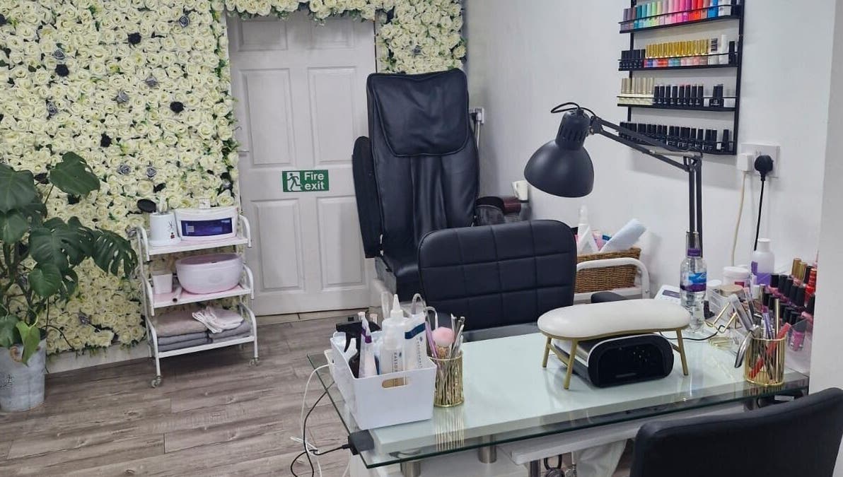 Cozy nail salon corner at Zamira Nails in Birmingham, England, GB, featuring elegant floral decor and manicure station.