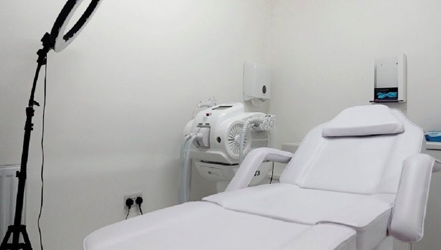 Modern treatment room at Simply Glamorous Aesthetics in Paisley, Scotland, GB, featuring a comfortable chair.