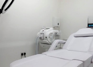 Modern treatment room at Simply Glamorous Aesthetics in Paisley, Scotland, GB, featuring a comfortable chair.