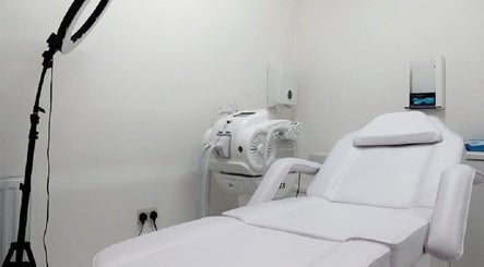 Modern treatment room at Simply Glamorous Aesthetics in Paisley, Scotland, GB, featuring a comfortable chair.