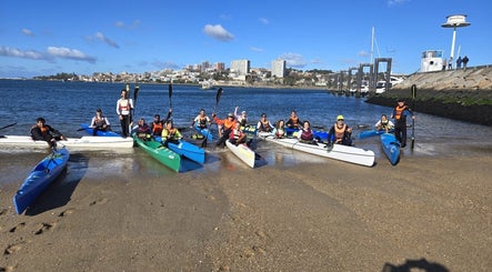 Group of paddlers with kayaks at Nelo & Surfing Porto Paddling Center, Vila Nova De Gaia, Porto, PT.
