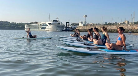 Yoga paddleboards at Nelo & Surfing Porto Paddling Center, Vila Nova De Gaia, Porto, PT, enhancing relaxation.