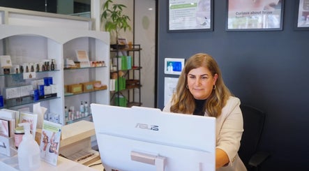 Front desk at Teo Saloon in Kuala Lumpur, showcasing a welcoming ambiance and skincare products.