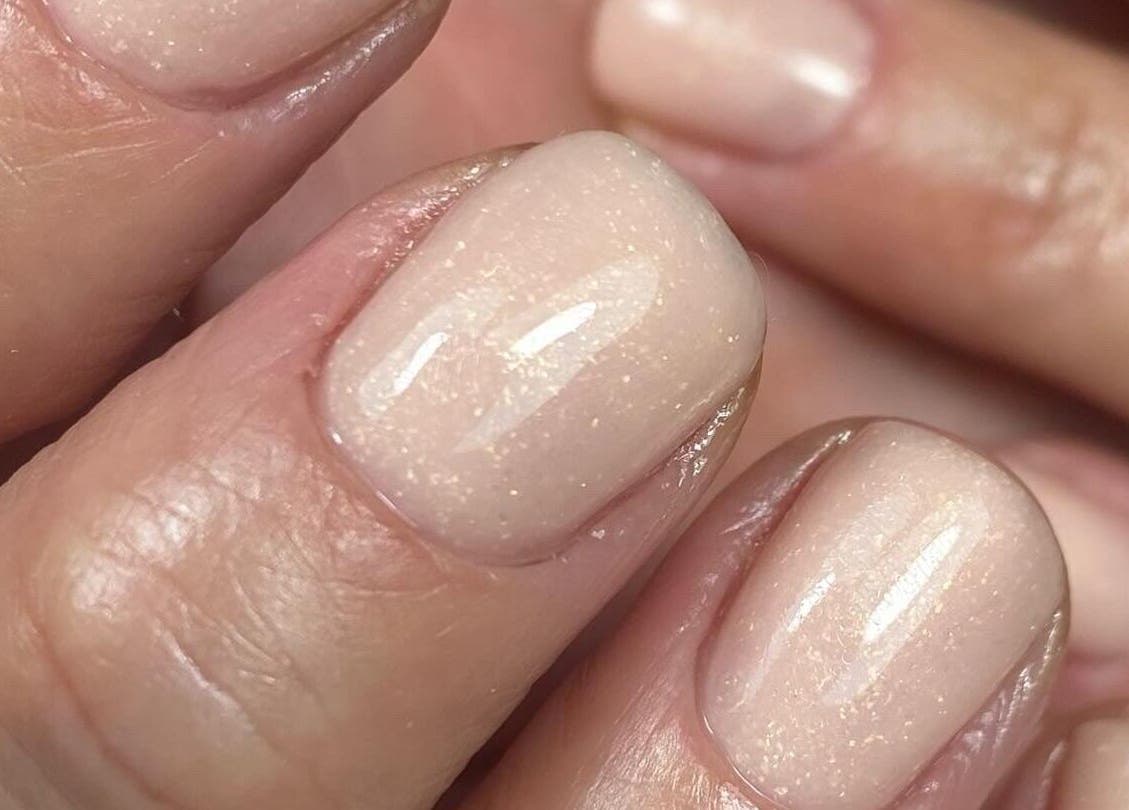 Close-up of elegant nude nails at Bloom & Noble Nails, Swindon, England, GB.