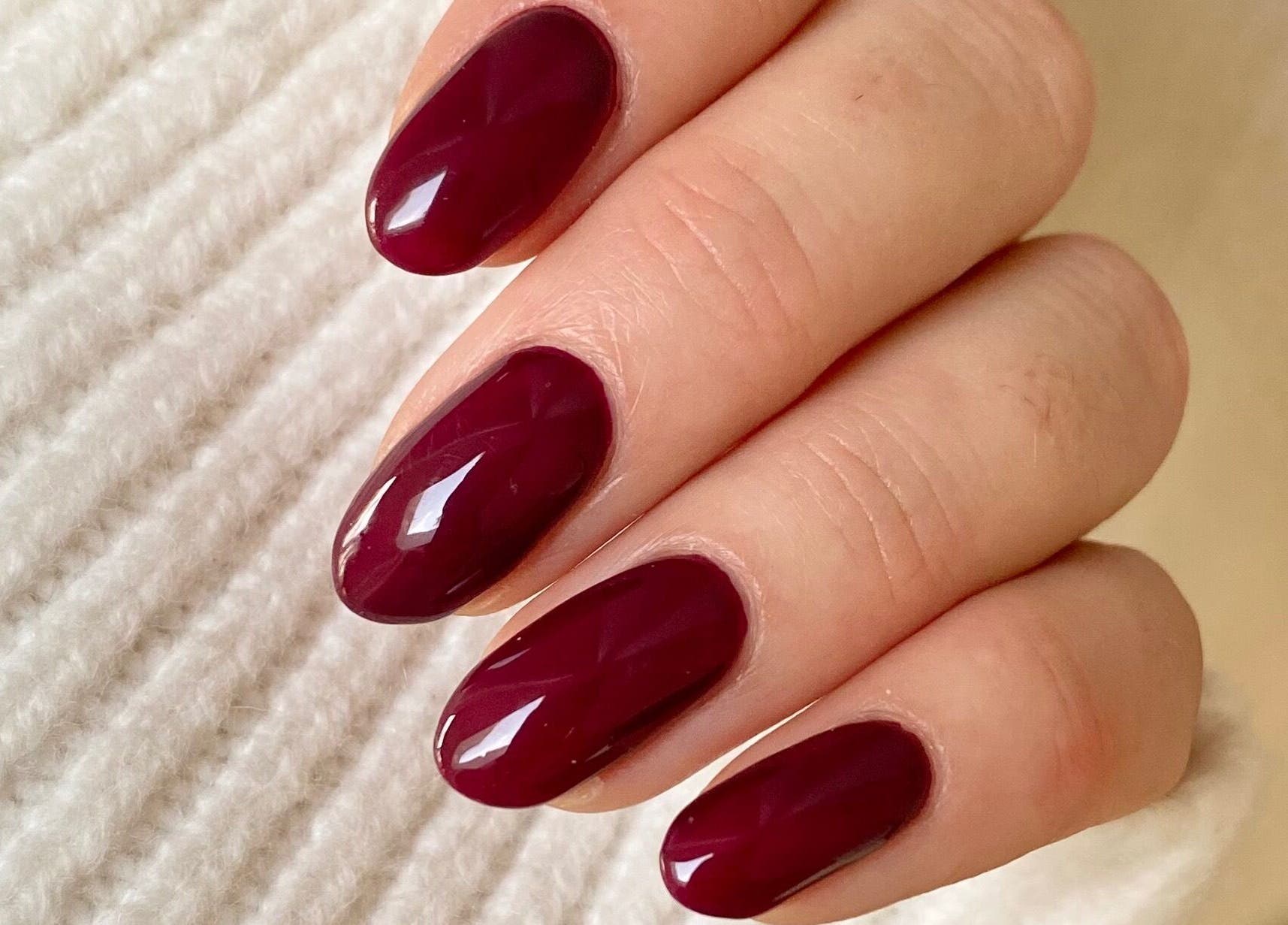 Crimson red nail art at Bloom & Noble Nails, Swindon, England, GB, showcasing elegant manicure.