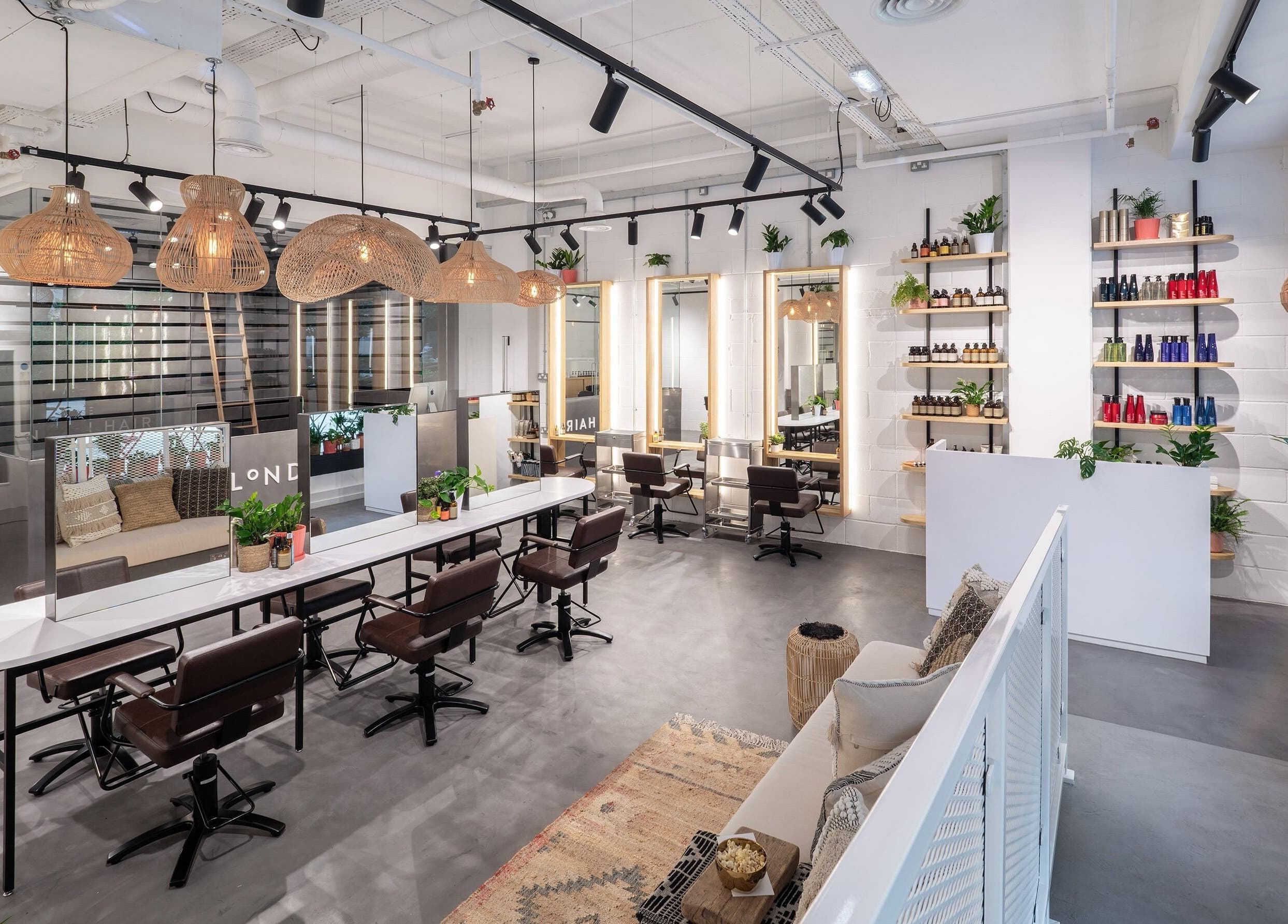 Modern interior of Vixen & Blush Hair Extensions in London, England, GB showcasing sleek salon chairs and decor.