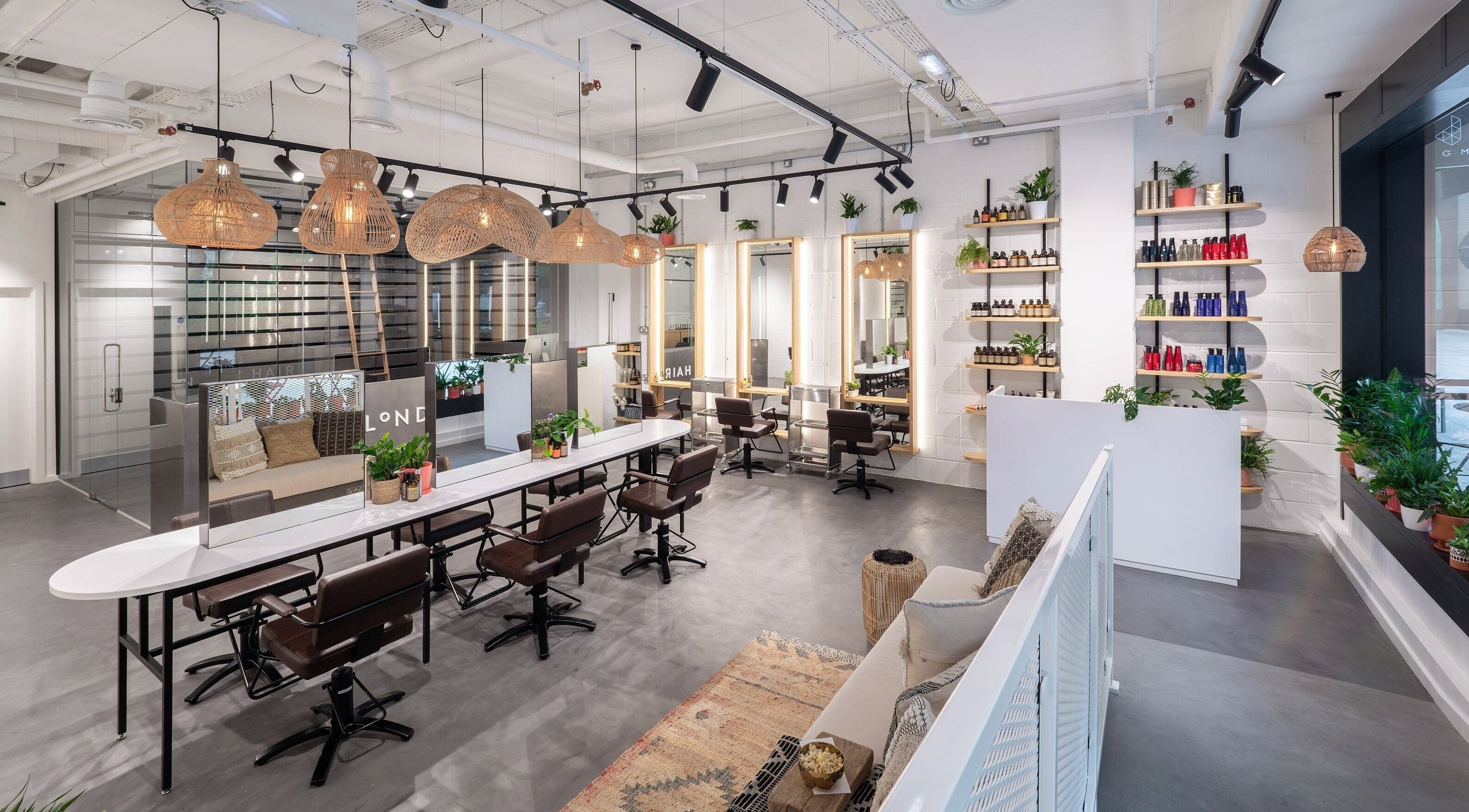 Modern interior of Vixen & Blush Hair Extensions in London, England, GB showcasing sleek salon chairs and decor.