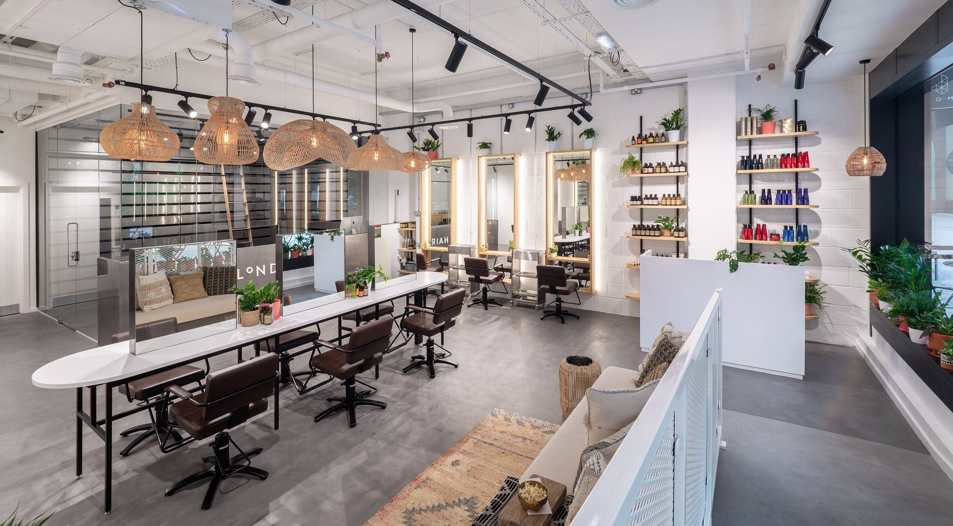 Modern interior of Vixen & Blush Hair Extensions in London, England, GB showcasing sleek salon chairs and decor.