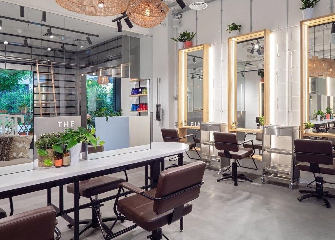 Modern salon interior at Vixen & Blush Hair Extensions in London, England, GB with stylish design and seating.