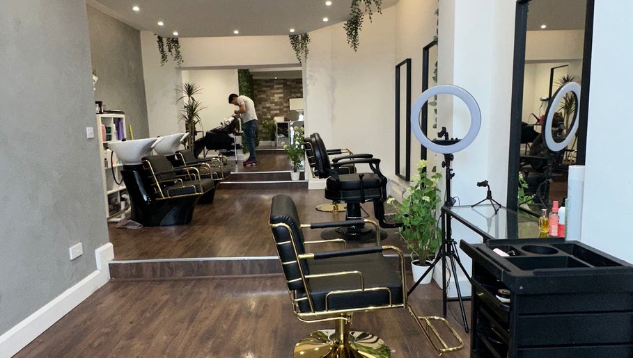 Chic interior of Adriana Guzman Hairdresser in Dublin, County Dublin, IE, featuring elegant styling chairs and decor.