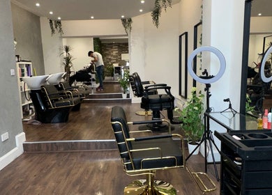 Chic interior of Adriana Guzman Hairdresser in Dublin, County Dublin, IE, featuring elegant styling chairs and decor.
