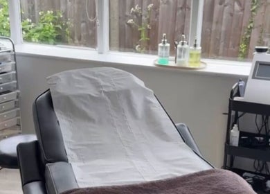 Calm treatment room at CM Enhance Aesthetic Clinic & Academy in Brightlingsea, England, GB, featuring a comfortable bed.