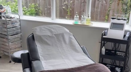 Calm treatment room at CM Enhance Aesthetic Clinic & Academy in Brightlingsea, England, GB, featuring a comfortable bed.