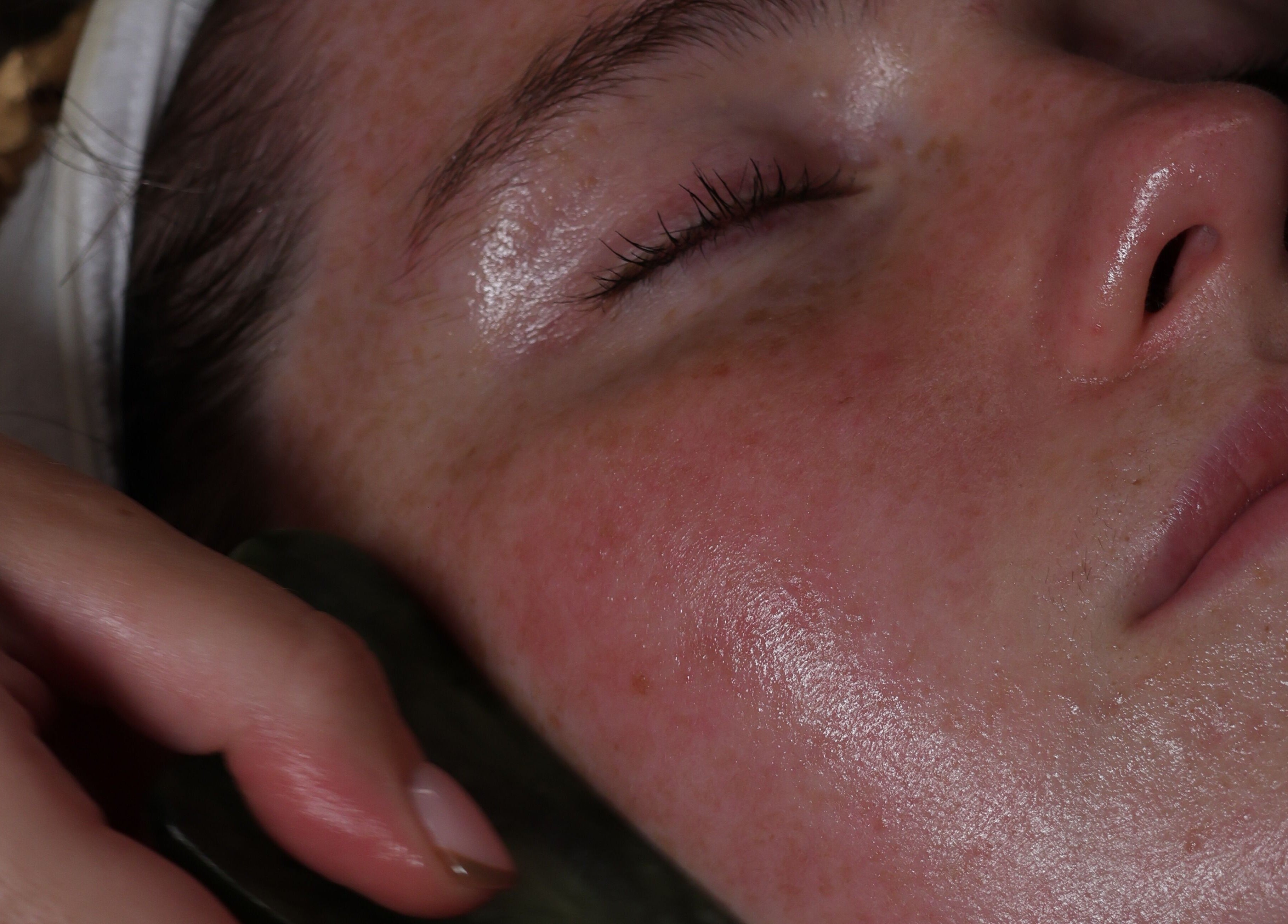 Close-up of a facial treatment at Spa Ukiyo in Stafford, England, GB, showcasing smooth, glowing skin.
