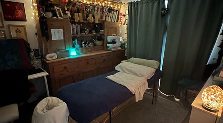 Cozy massage room at Everwell Massage Therapies - Lynnea in Brynsadler, Wales, GB, adorned with calming lighting.