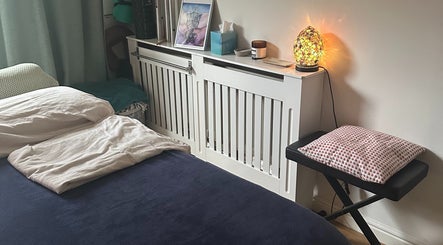 Cozy massage room at Everwell Massage Therapies - Lynnea in Brynsadler, Wales, GB, featuring a serene setup.