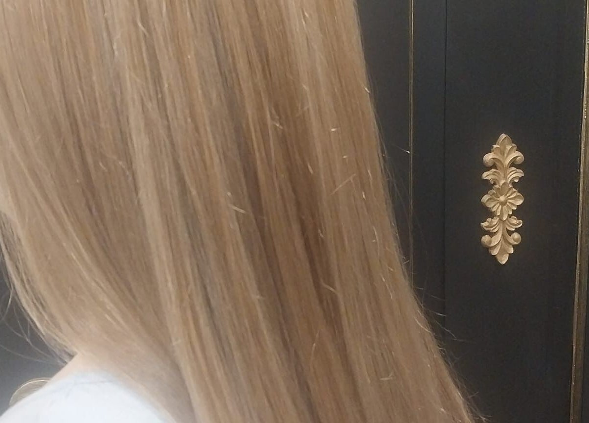 Lustrous blonde hair styled at Hair on Langdon Craigieburn, Victoria, AU, showcasing a sleek finish.