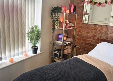 Relaxing treatment room at Clarissa K Beauty Boutique, Blackpool, England, GB with elegant decor and cozy bed.