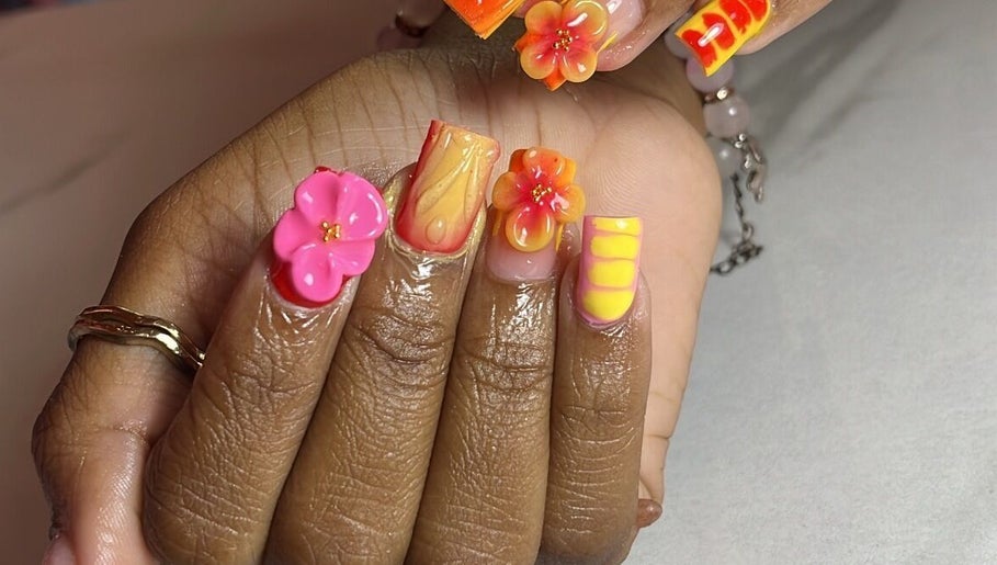 Vibrant floral nail art at Klassybarbz, Scarborough, Tobago, TT showcasing intricate 3D designs.