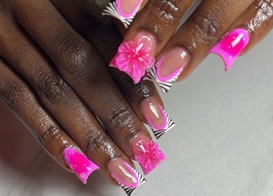 Detailed pink nail art at Klassybarbz, Scarborough, Tobago, TT. Intricate designs with floral accents.