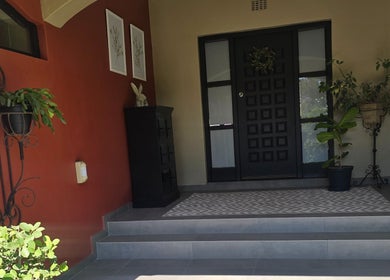 Inviting entrance at Dr Maritza Nienaber's venue in Middelburg, Mpumalanga, ZA with potted plants and decor.