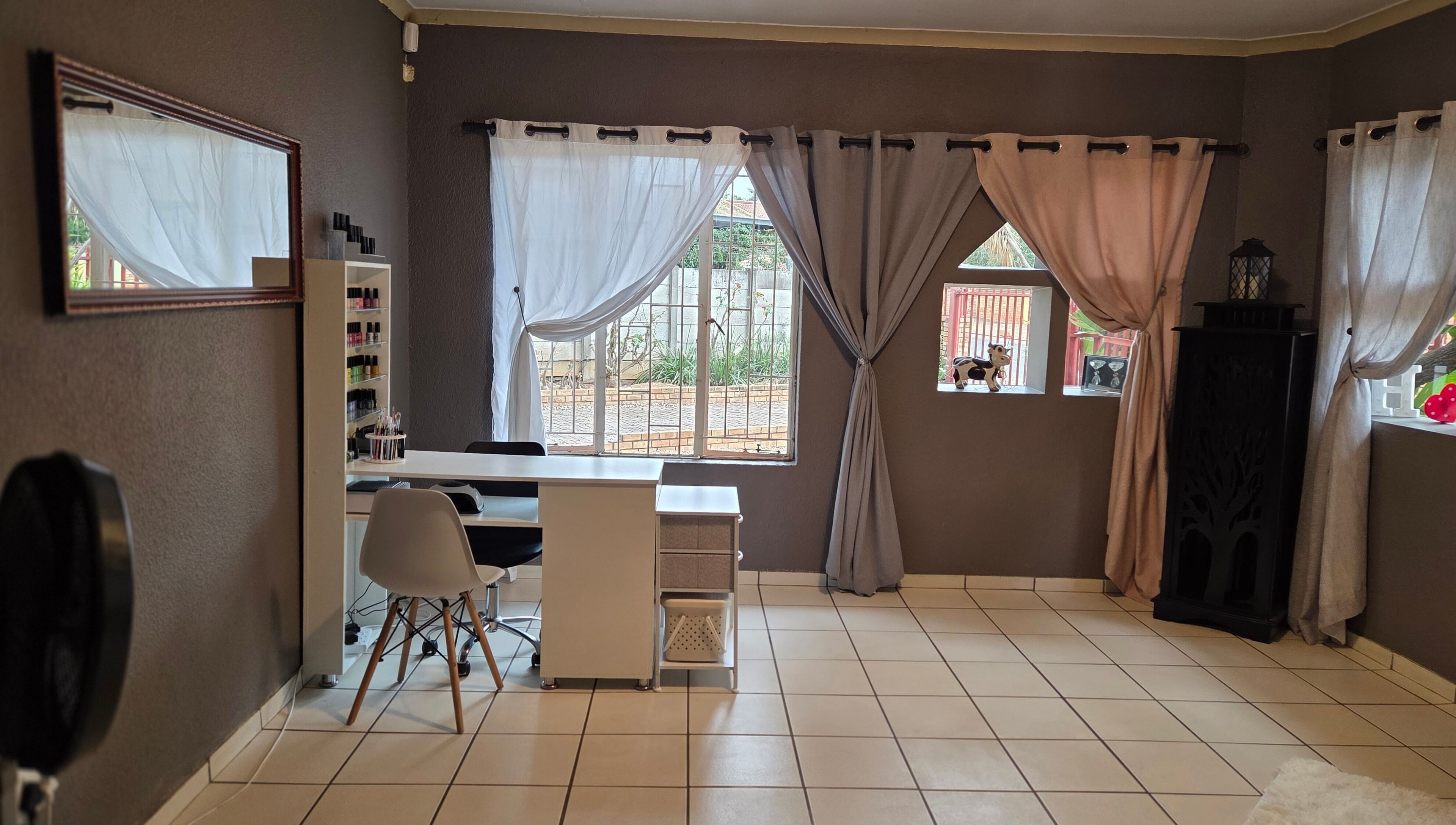 Elegant interior of Pretty Claws by Melisha in Rustenburg, North West, ZA with stylish nail station.