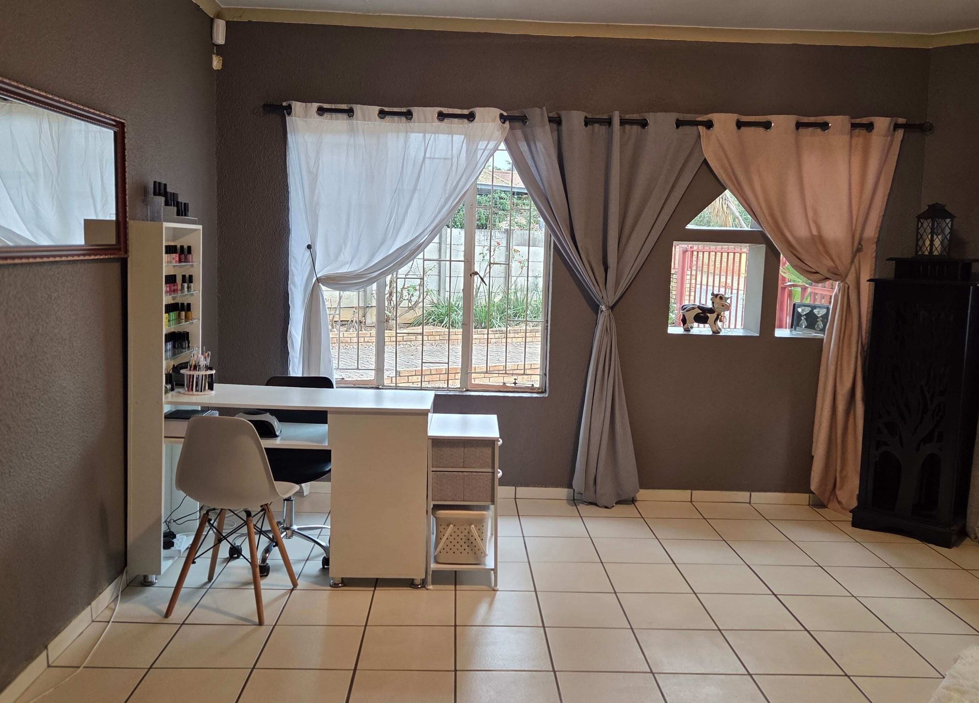 Elegant interior of Pretty Claws by Melisha in Rustenburg, North West, ZA with stylish nail station.