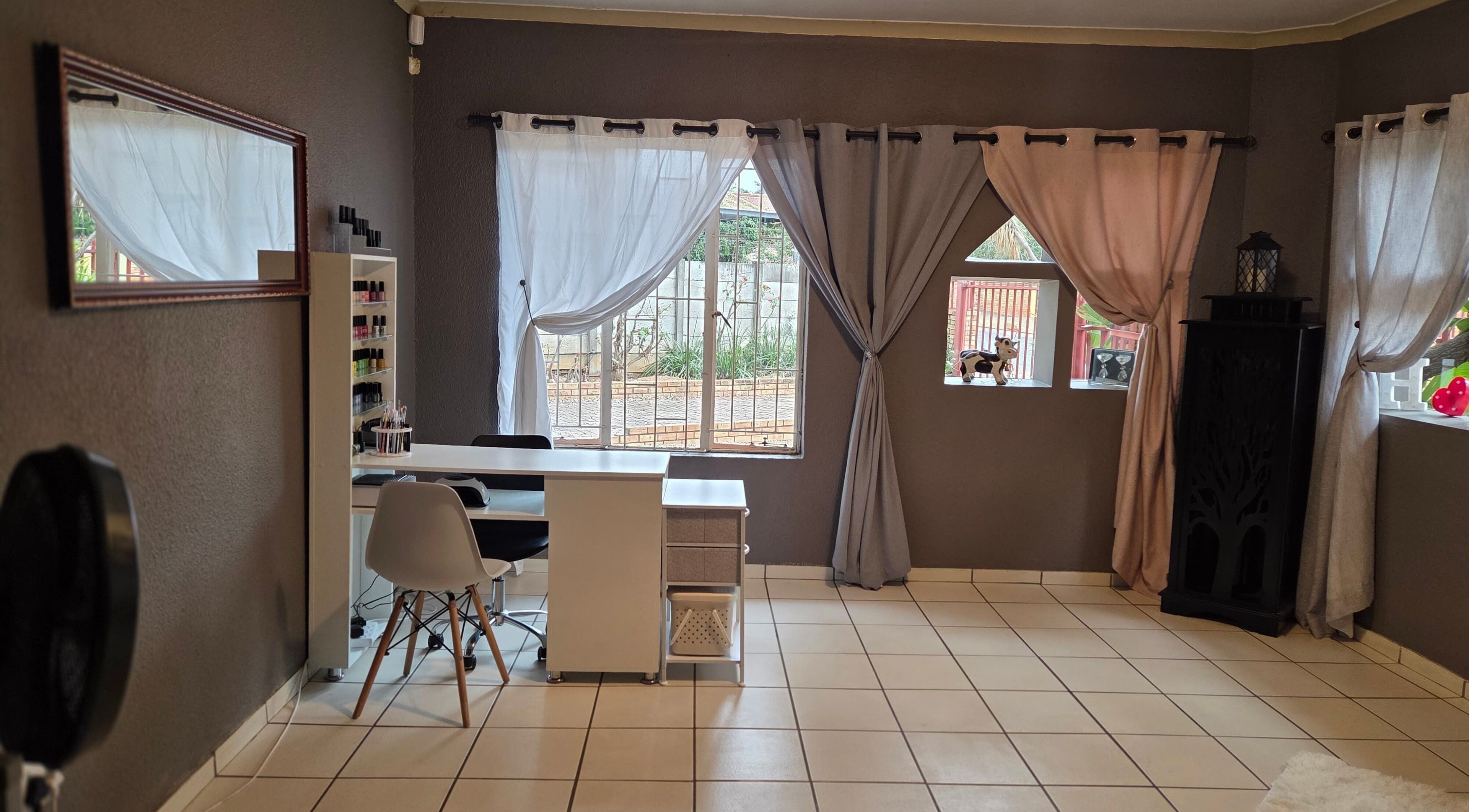 Elegant interior of Pretty Claws by Melisha in Rustenburg, North West, ZA with stylish nail station.